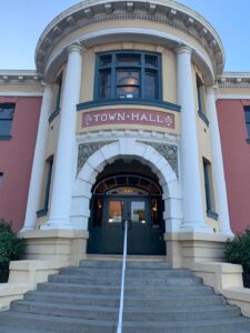 A historic Town Hall building with a rounded facade and large upper window, kept clean with professional window cleaning services.